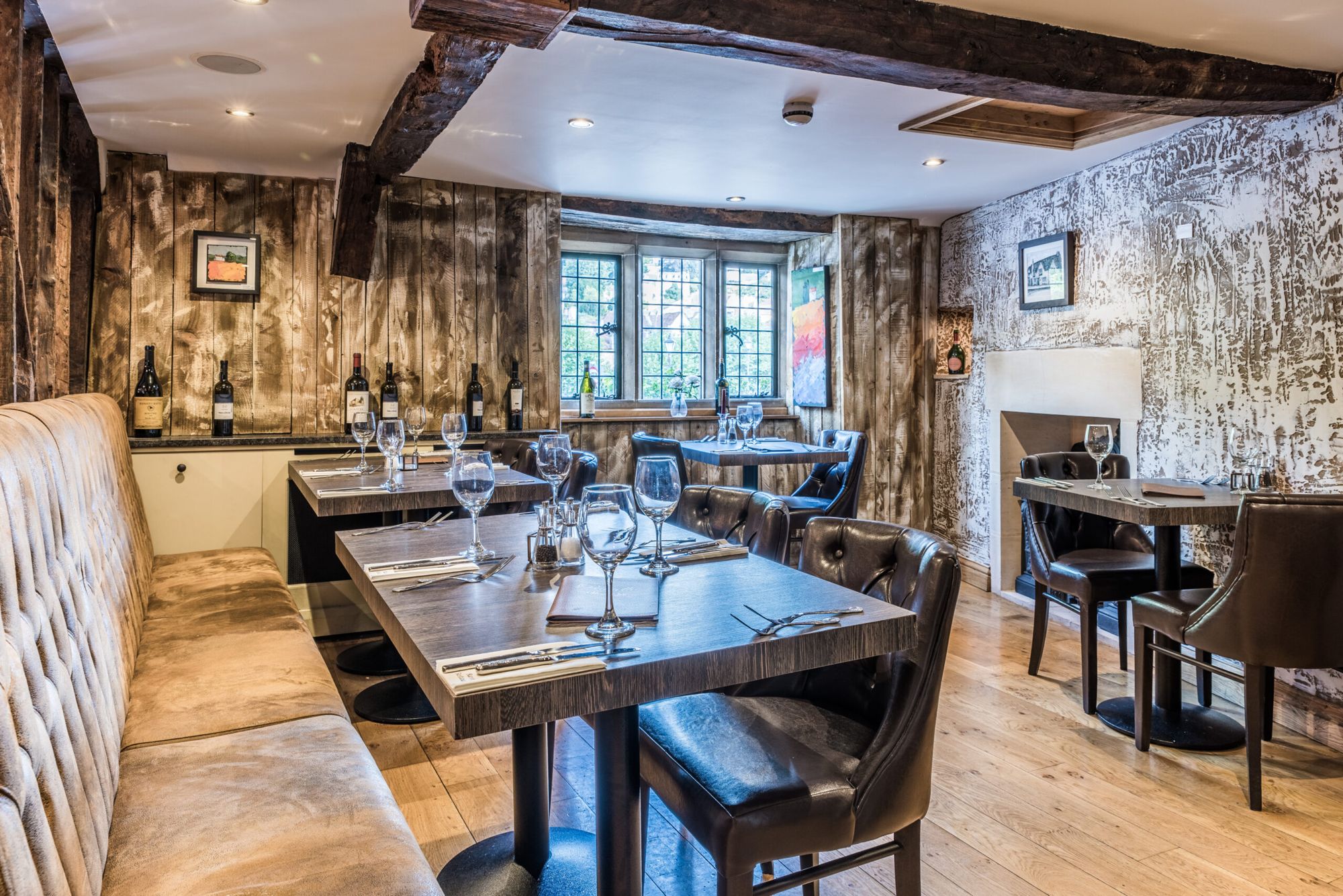The dining room at Ravello, with leaded windows and banquette seating
