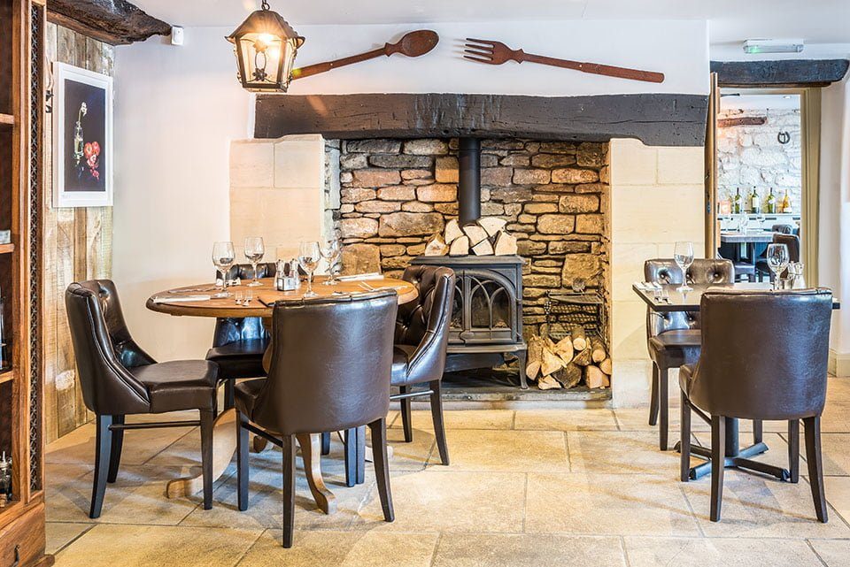 Tables beside the wood-burning stove