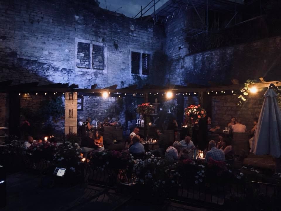 Diners on the lantern-lit terrace at night