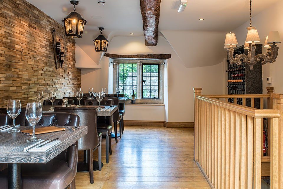 A dining room with lanterns and leaded windows